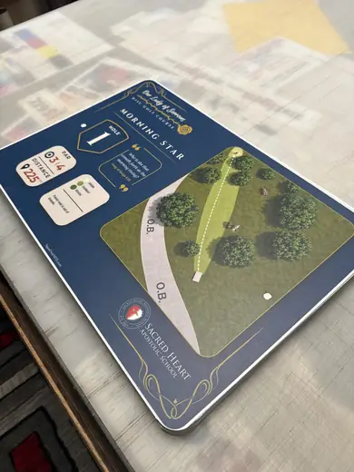 Custom printed sign laid out on a production table