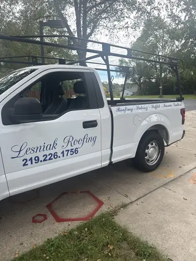 White pickup with script door lettering
