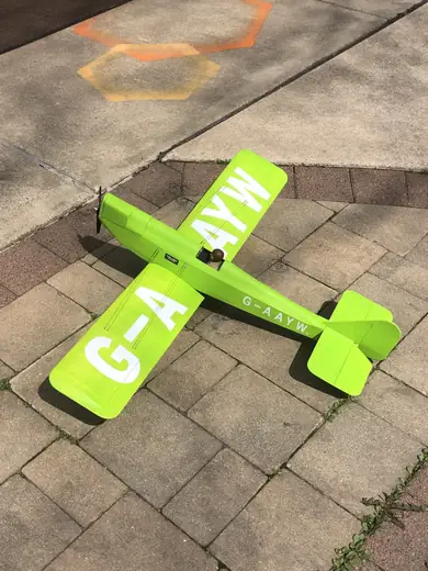Green stencil decal cut in the shape of an airplane