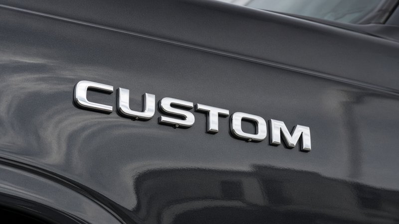 Stock chrome letters spelling a word on a vehicle door